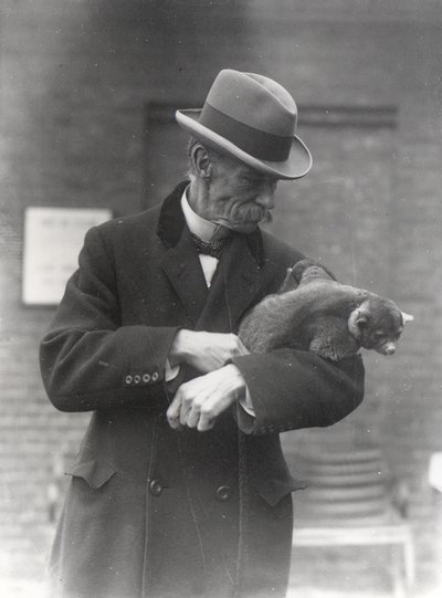 R. I. Pocock with a kinkajou by Frederick William Bond